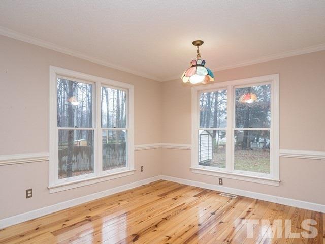 7201 Cedric Drive Raleigh, NC 27603 - Photo 12 of 25 a view of an empty room with a window