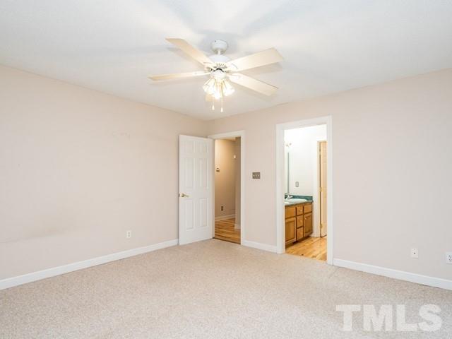 7201 Cedric Drive Raleigh, NC 27603 - Photo 15 of 25 a view of an empty room and chandelier fan