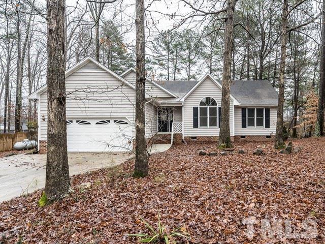 7201 Cedric Drive Raleigh, NC 27603 - Photo 25 of 25 a front view of a house with a garden