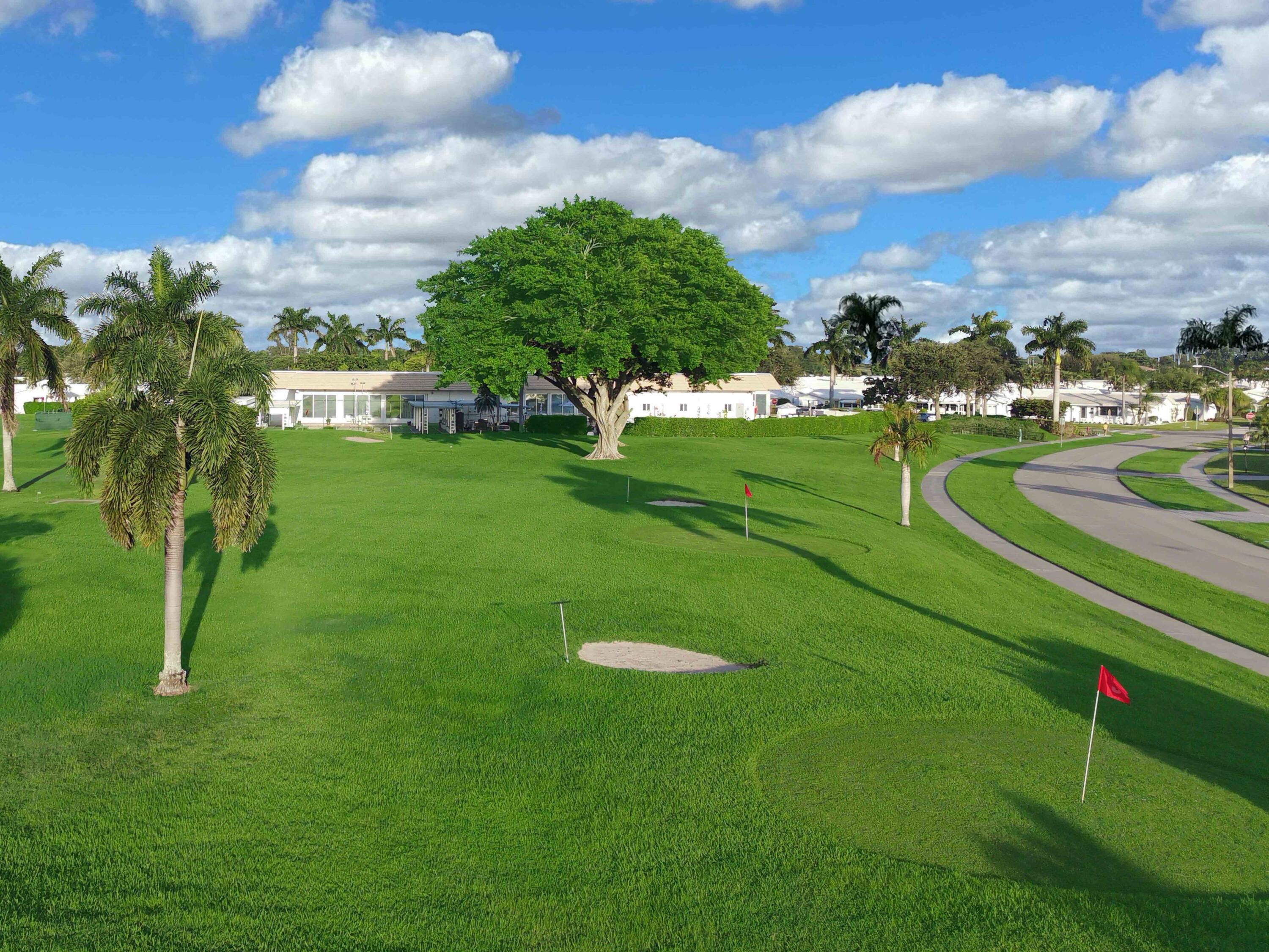 2019 Southwest 18th Drive Boynton Beach, FL 33426 - Photo 15 of 17 a view of a golf course with a lake