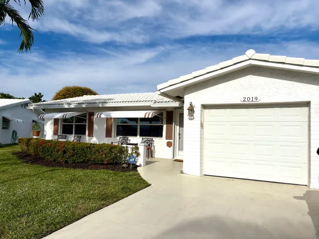 a view of a house with a garden