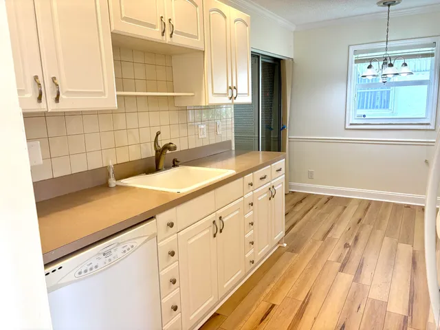 a bathroom with a sink and a window