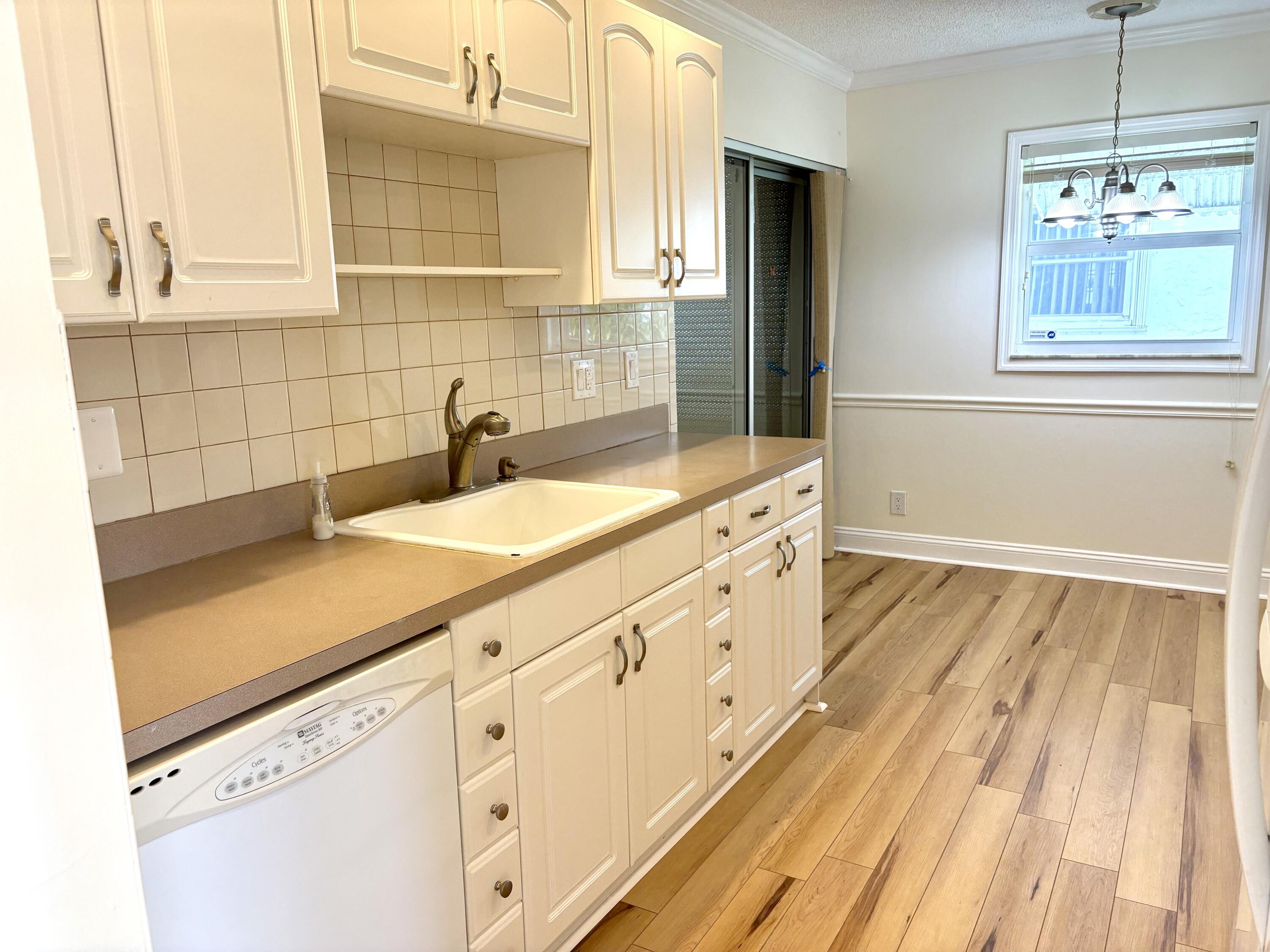 2019 Southwest 18th Drive Boynton Beach, FL 33426 - Photo 5 of 17 a bathroom with a sink and a window