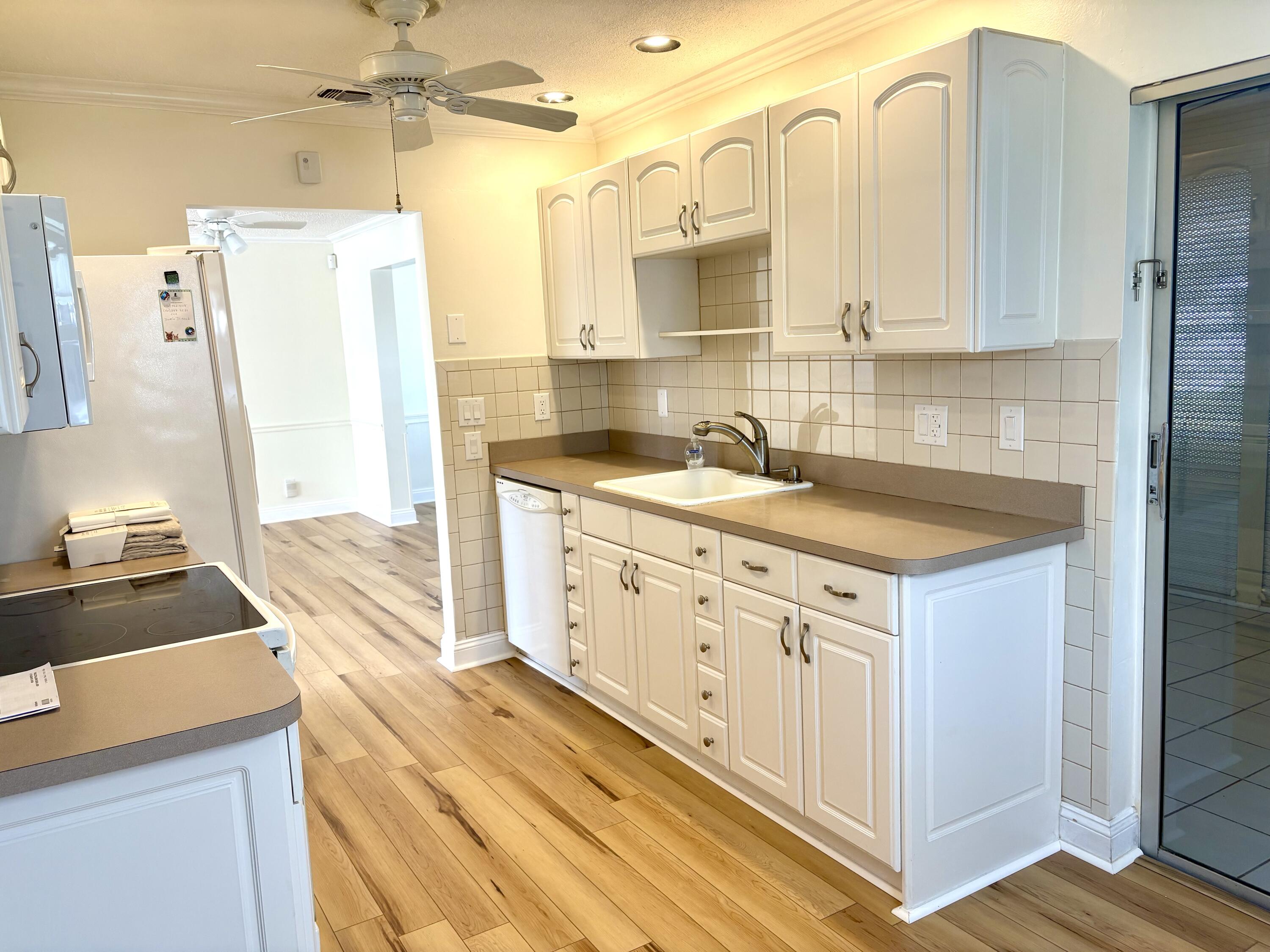 2019 Southwest 18th Drive Boynton Beach, FL 33426 - Photo 6 of 17 a kitchen with a sink stove and refrigerator