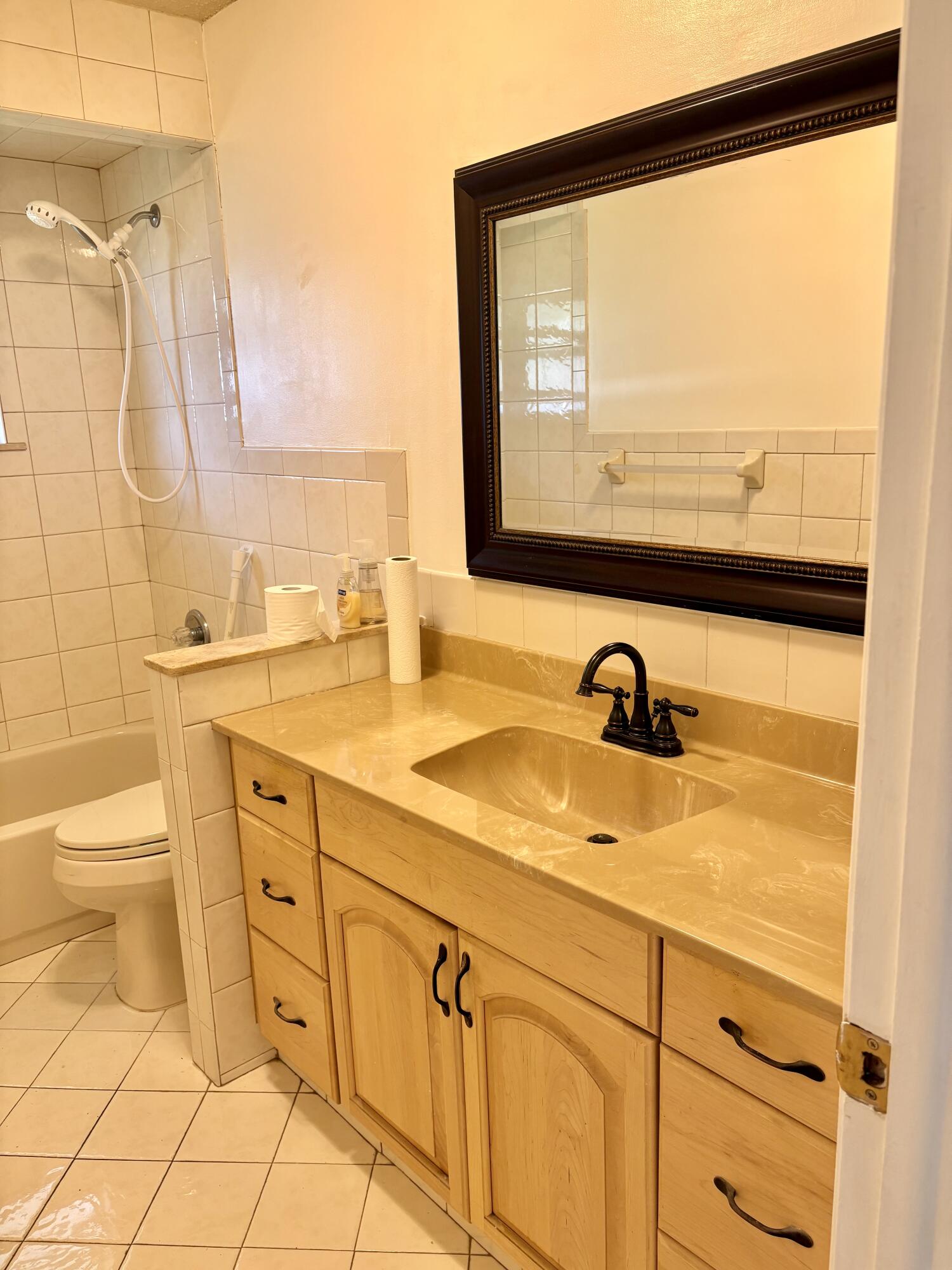 2019 Southwest 18th Drive Boynton Beach, FL 33426 - Photo 8 of 17 a bathroom with a sink and a mirror