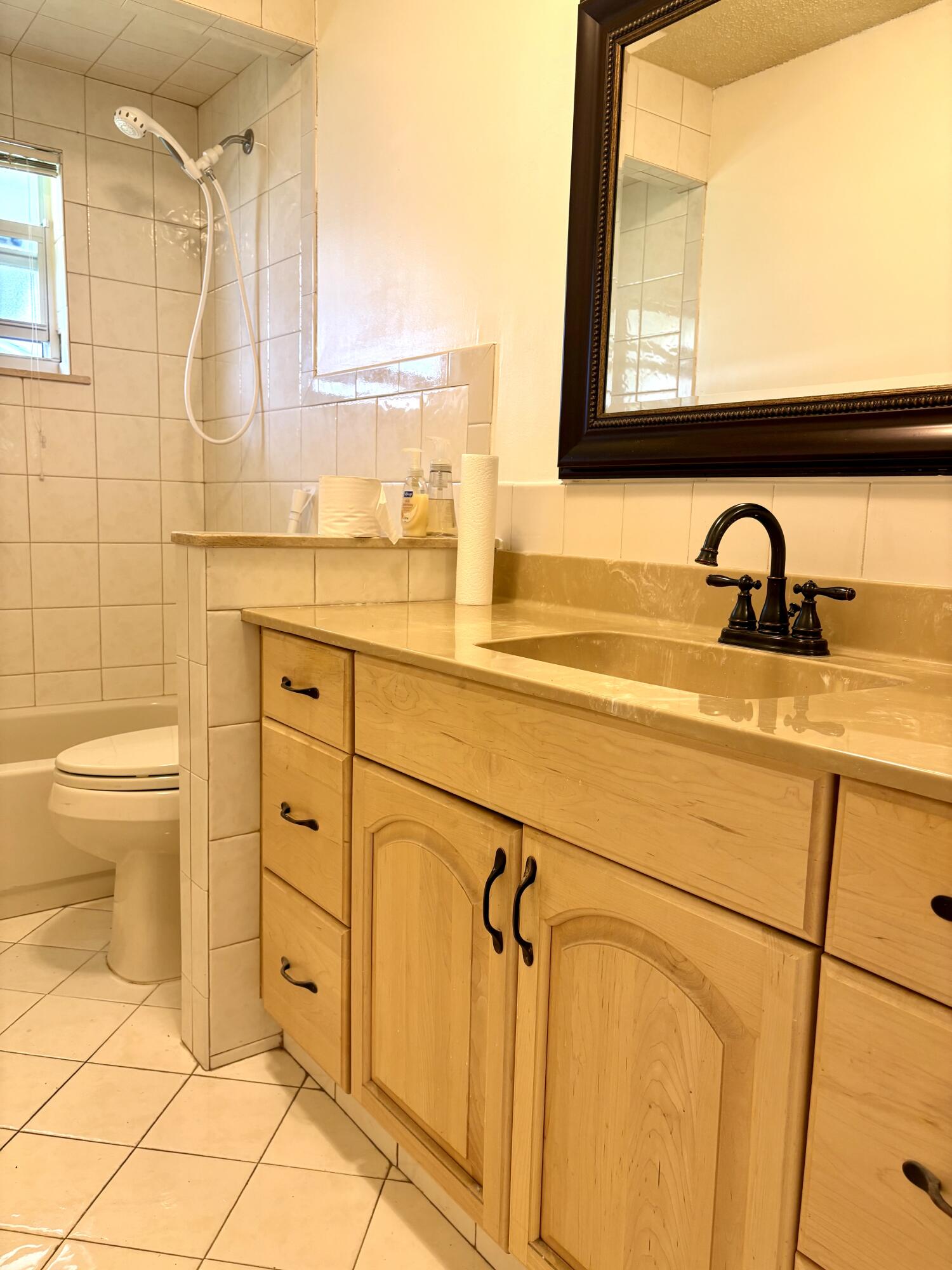 2019 Southwest 18th Drive Boynton Beach, FL 33426 - Photo 9 of 17 a bathroom with a sink and a toilet