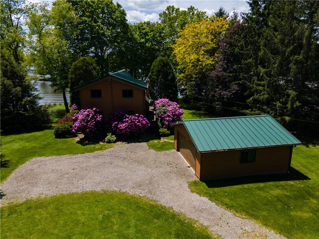 374 Latonka Drive Mercer, PA 16137 - Photo 3 of 50 a view of backyard with garden and flowers