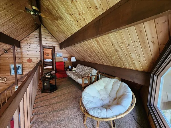 a bedroom with furniture and a window