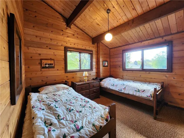 a bedroom with furniture and a window