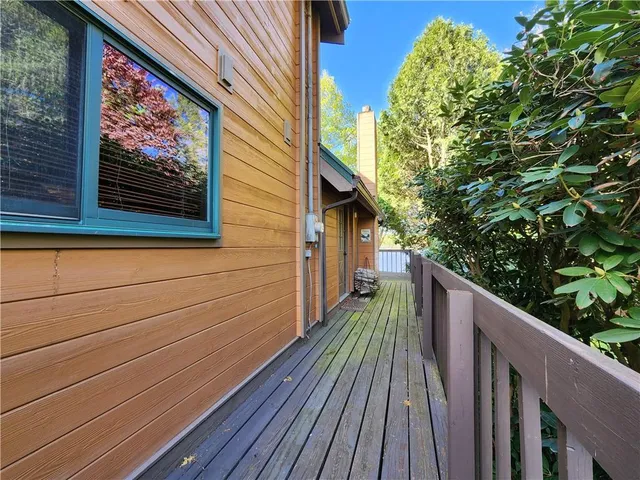 a view of balcony with wooden floor