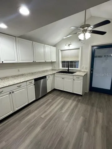 a kitchen with cabinets a sink and dishwasher