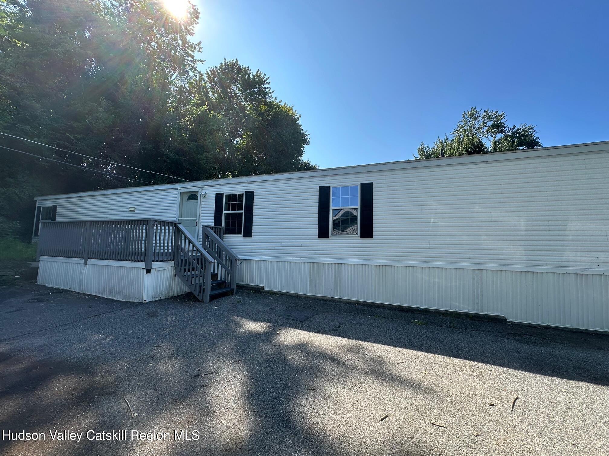 2699 Highway 22, Unit 2 Patterson, NY 12563 - Photo 2 of 11 a view of a house with a yard