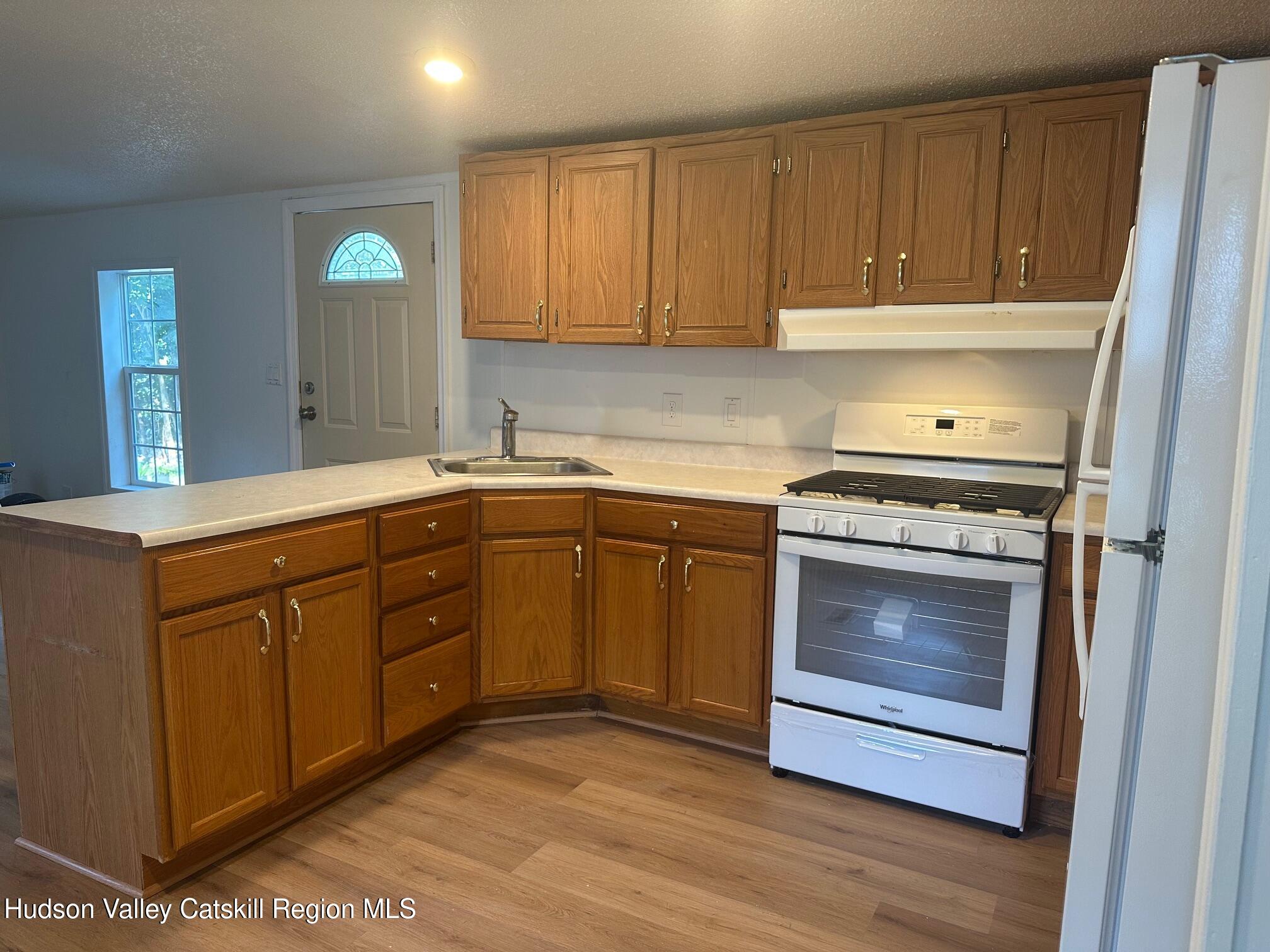 2699 Highway 22, Unit 2 Patterson, NY 12563 - Photo 4 of 11 a kitchen with sink cabinets and appliances