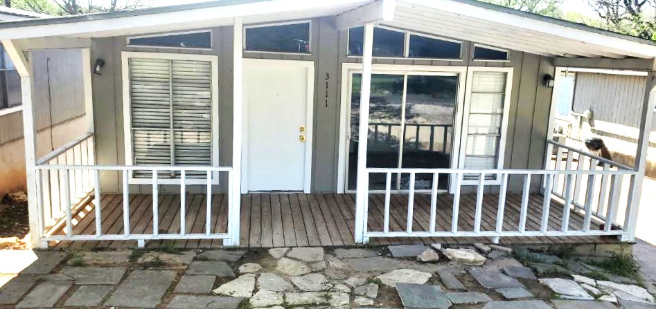 a front view of a house with a porch