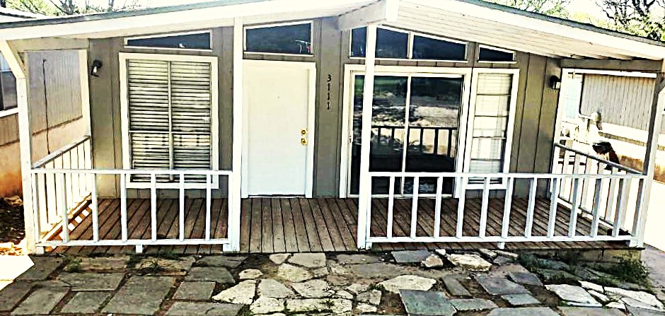 a front view of a house with glass windows