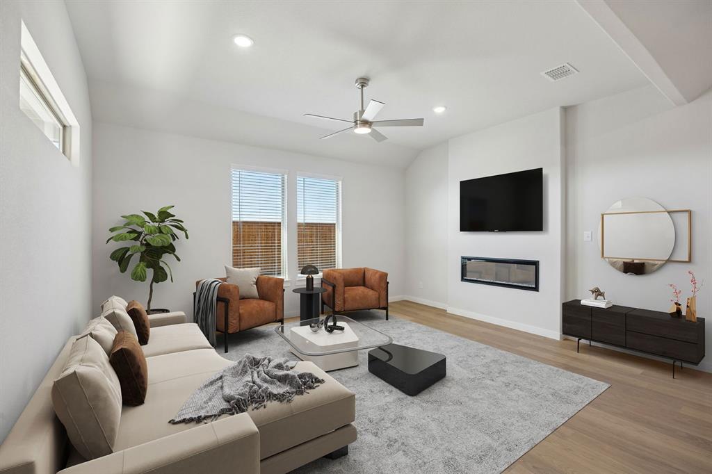 1461 Companero Street Haslet, TX 76052 - Photo 10 of 35 a living room with furniture and a flat screen tv
