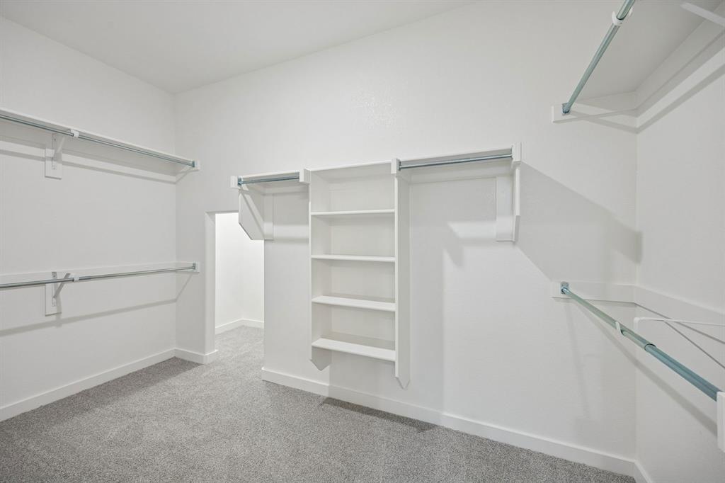 1461 Companero Street Haslet, TX 76052 - Photo 19 of 35 a view of an empty walk in closet