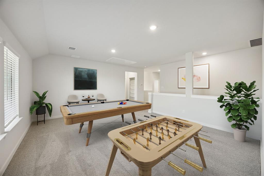 1461 Companero Street Haslet, TX 76052 - Photo 20 of 35 a living room with furniture a flat screen tv and a potted plant