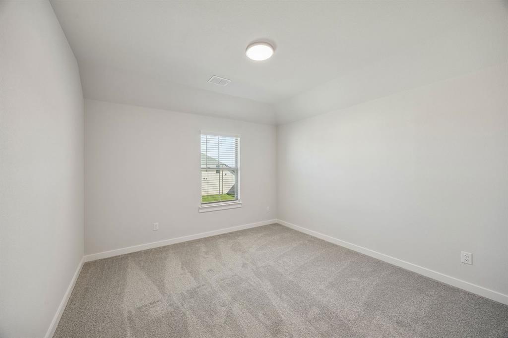 1461 Companero Street Haslet, TX 76052 - Photo 24 of 35 an empty room with windows