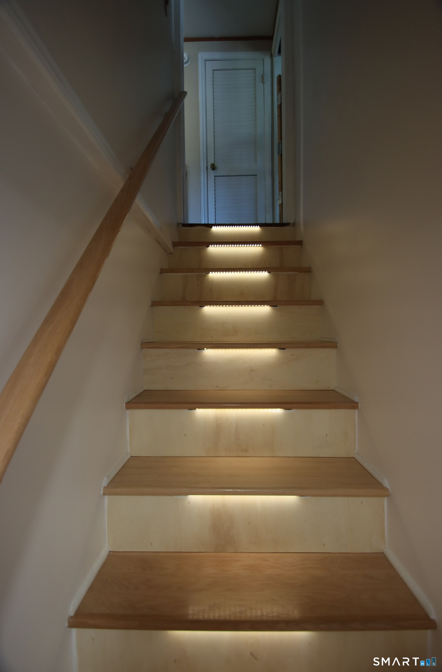 11 Forest Road Wallingford, CT 06492 - Photo 23 of 27 Stairs to the lower level feature motion detected led lighting.