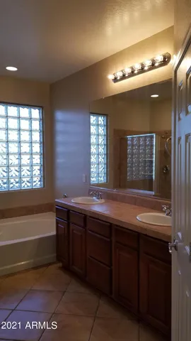a bathroom with a sink and a large mirror