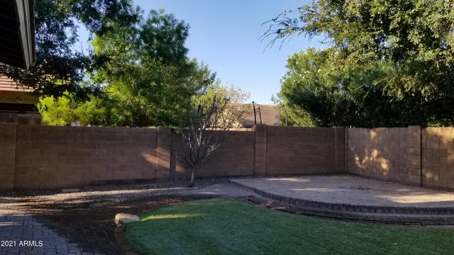 a view of backyard with green space