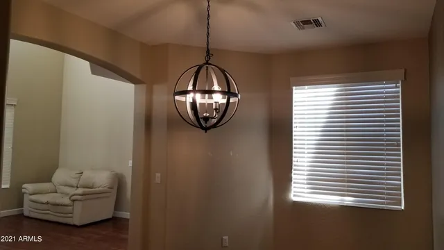 a view of a livingroom with furniture and windows