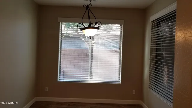 a room with window and a glass door