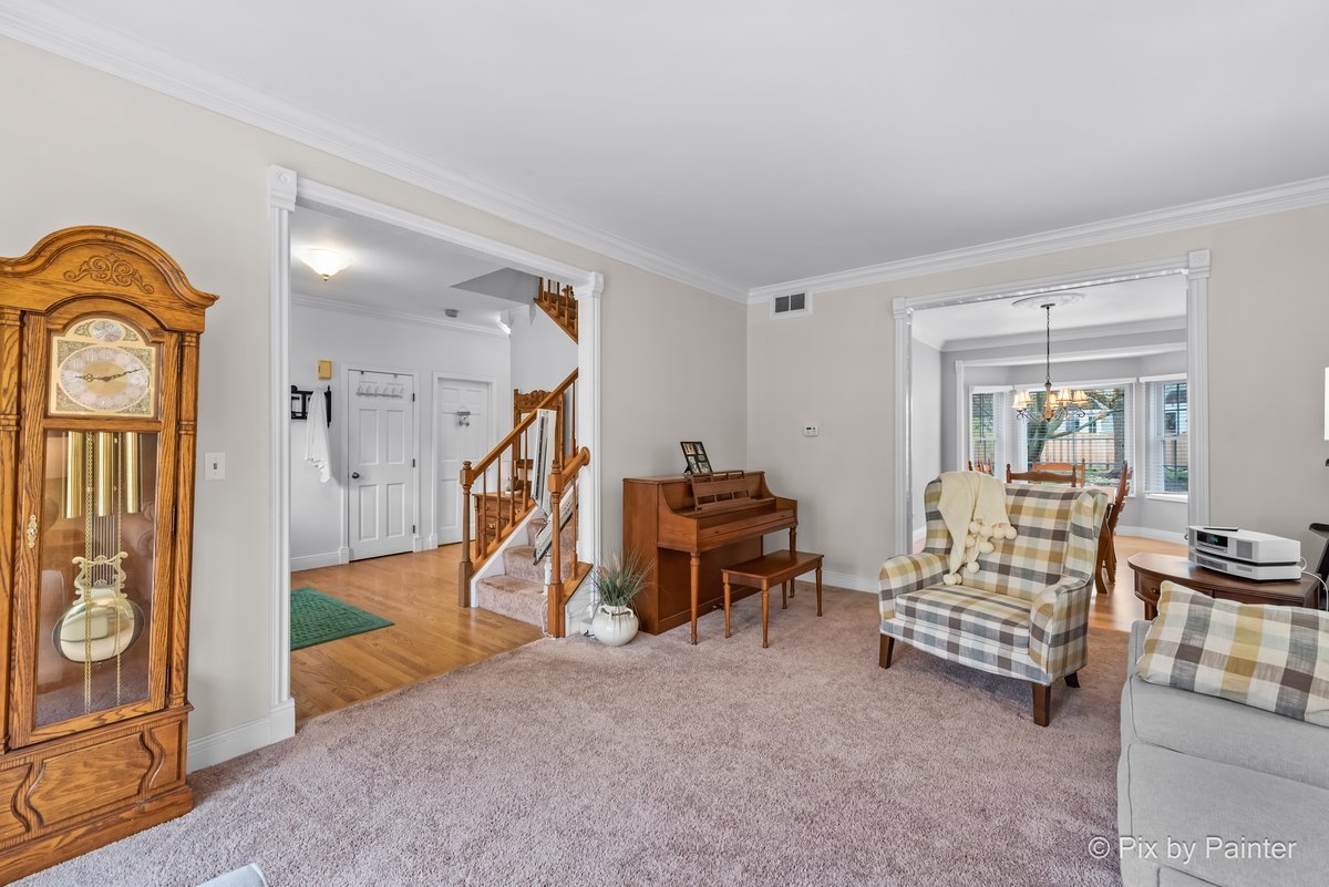 249 Adare Drive Cary, IL 60013 - Photo 12 of 36 a living room with furniture and a wooden floor