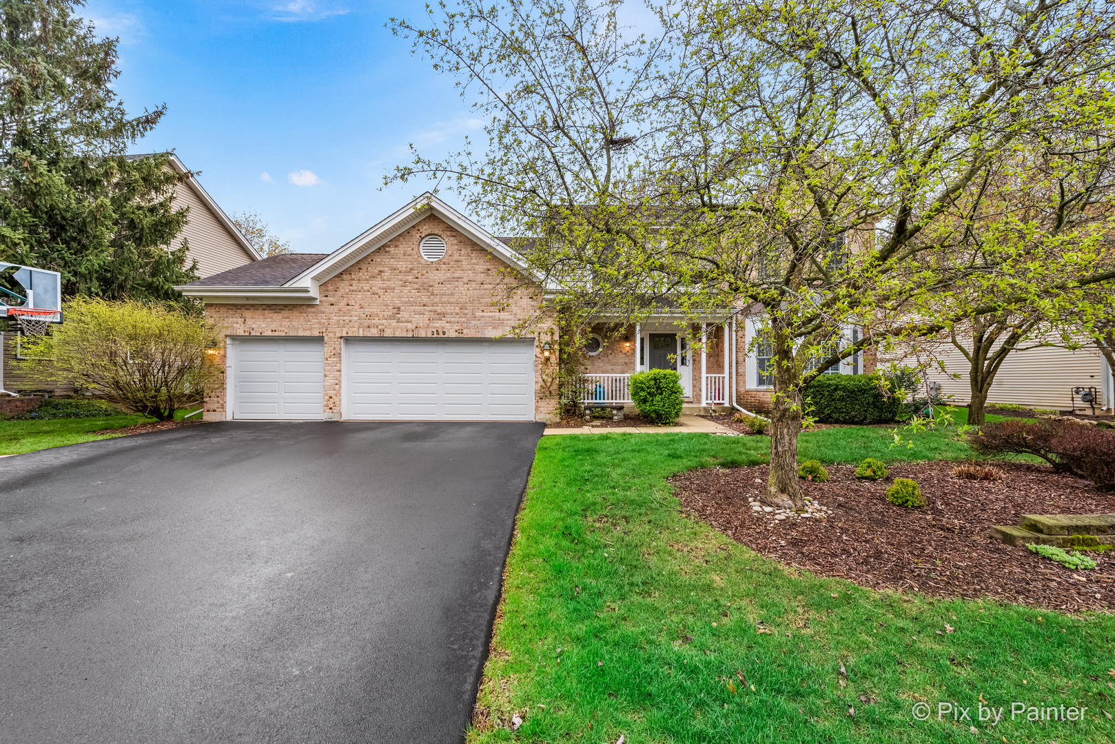 249 Adare Drive Cary, IL 60013 - Photo 2 of 36 a front view of a house with a yard and garage
