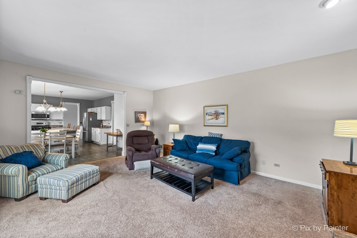 249 Adare Drive Cary, IL 60013 - Photo 22 of 36 a living room with furniture and a table