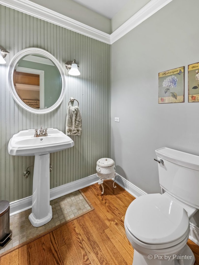 249 Adare Drive Cary, IL 60013 - Photo 24 of 36 a bathroom with a toilet a sink and a mirror