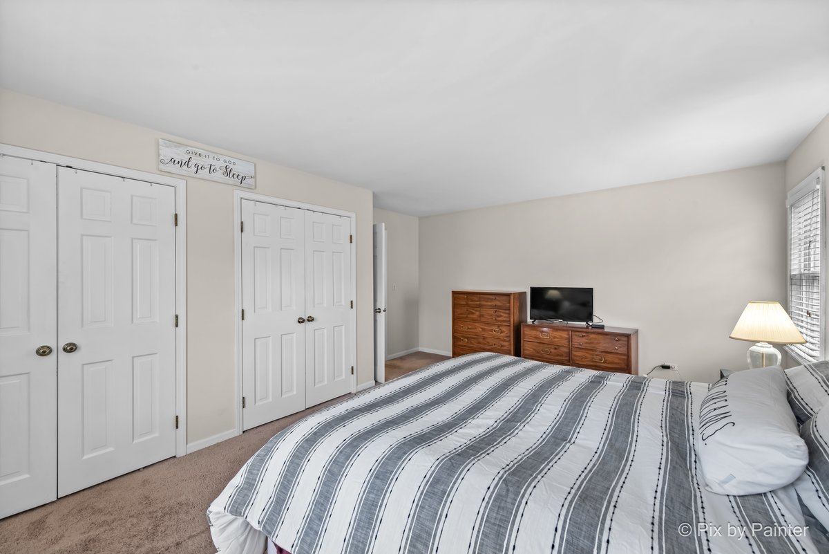 249 Adare Drive Cary, IL 60013 - Photo 31 of 36 a bedroom with a bed and a tv