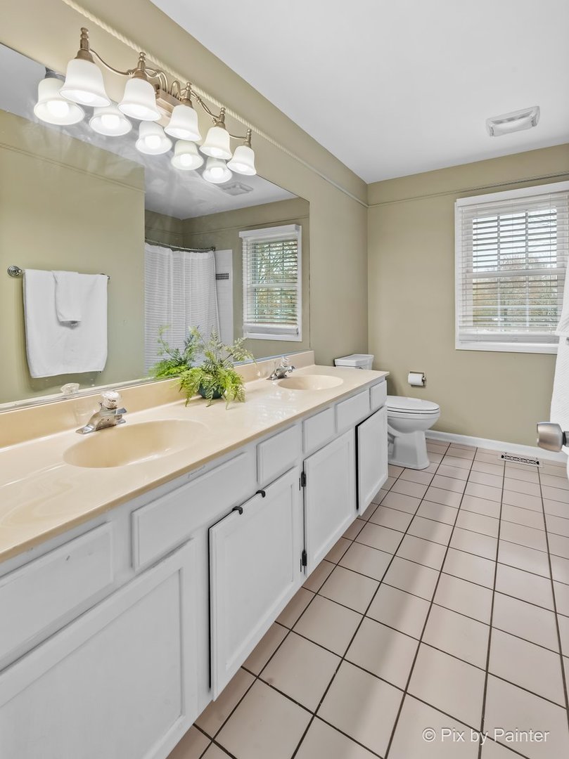 249 Adare Drive Cary, IL 60013 - Photo 34 of 36 a spacious bathroom with a double vanity sink mirror and a