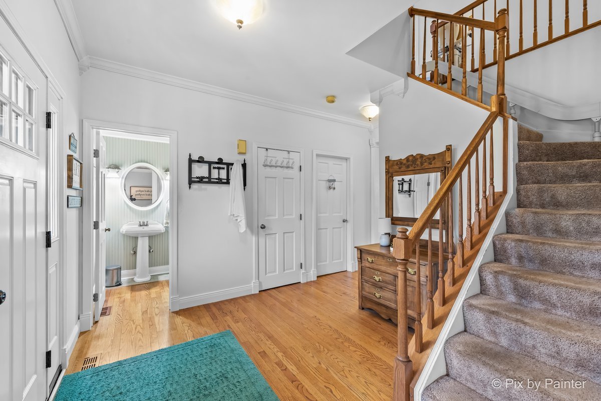 249 Adare Drive Cary, IL 60013 - Photo 10 of 36 a view of an entryway with wooden floor and a livingroom view