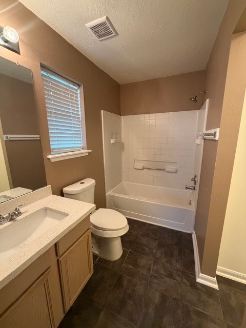 8626 Valley Crest Lane Houston, TX 77075 - Photo 9 of 14 a bathroom with a sink a toilet and shower