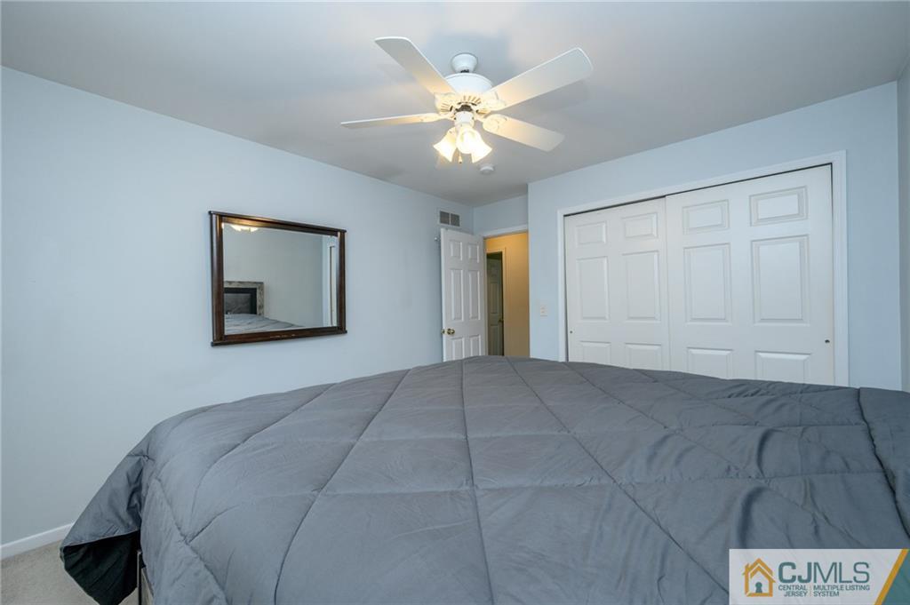 9 Pebble Beach Way Washington, NJ 07882 - Photo 29 of 42 a view of a livingroom with a ceiling fan and window
