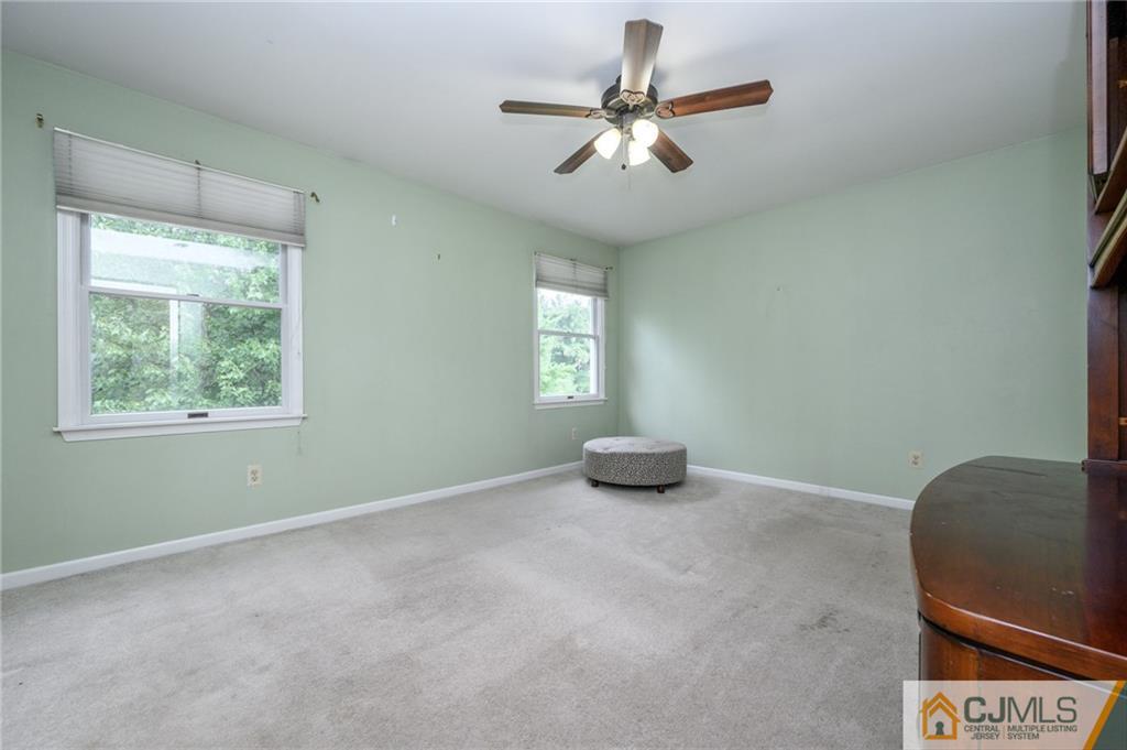 9 Pebble Beach Way Washington, NJ 07882 - Photo 30 of 42 an empty room with windows and fan
