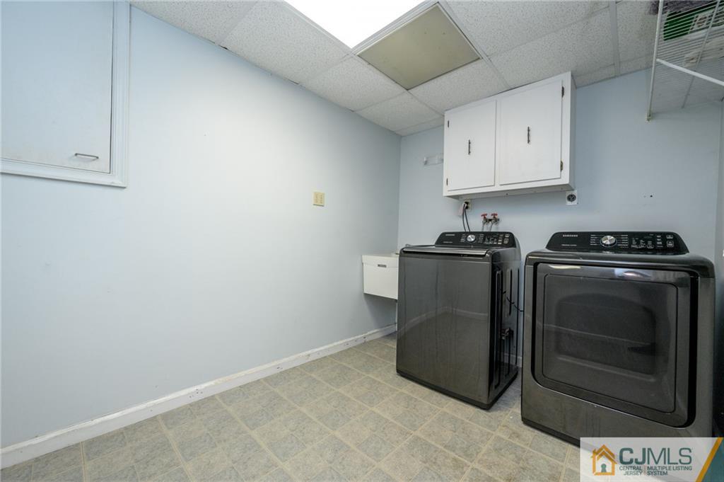 9 Pebble Beach Way Washington, NJ 07882 - Photo 33 of 42 a utility room with sink dryer and washer