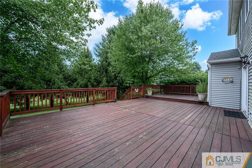 9 Pebble Beach Way Washington, NJ 07882 - Photo 35 of 42 a view of deck with wooden floor and fence