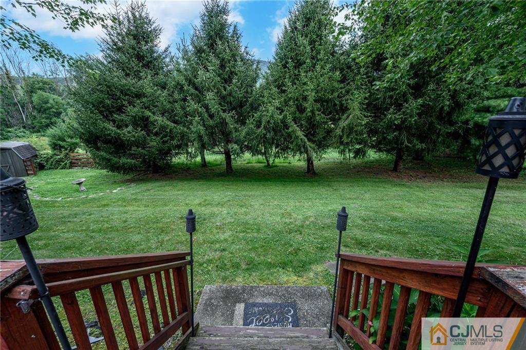 9 Pebble Beach Way Washington, NJ 07882 - Photo 39 of 42 a view of a wooden deck and garden