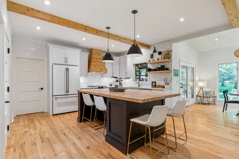 a living room with furniture and fireplace