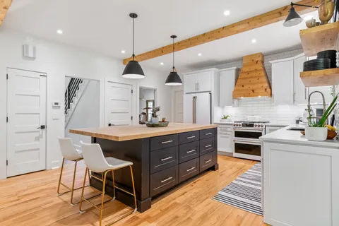 a living room with fireplace furniture and a flat screen tv