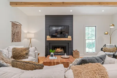 a bed room with furniture and a window