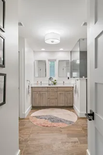 a view of a chair and tables in the balcony