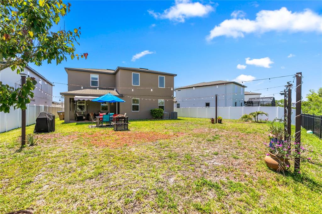 5637 Beggs Road St. Cloud, FL 34771 - Photo 27 of 35 a swimming pool view with a outdoor space