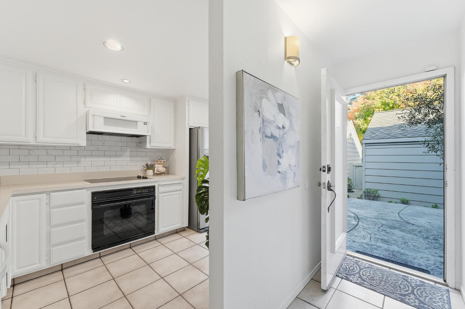 230 West Rumble Road, Unit C Modesto, CA 95350 - Photo 13 of 54 a kitchen with stainless steel appliances granite countertop a refrigerator and a stove top oven