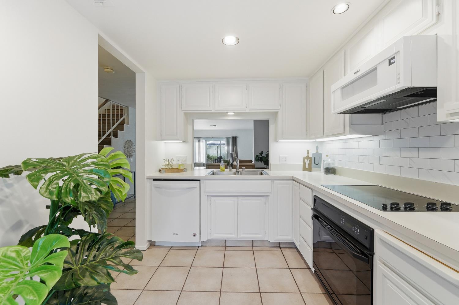 230 West Rumble Road, Unit C Modesto, CA 95350 - Photo 17 of 54 a kitchen with a white stove top oven and sink