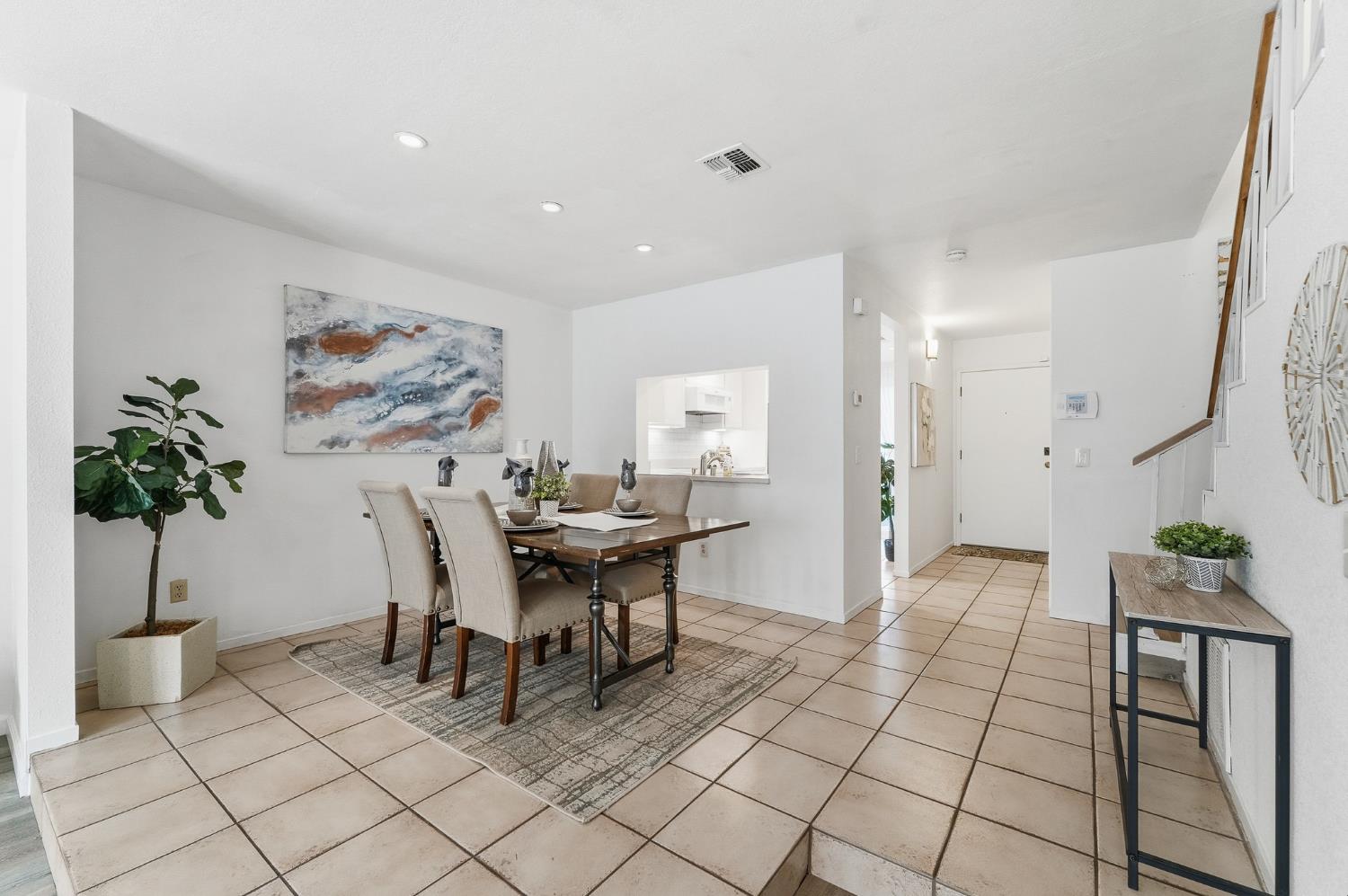 230 West Rumble Road, Unit C Modesto, CA 95350 - Photo 24 of 54 a view of a dining room with furniture