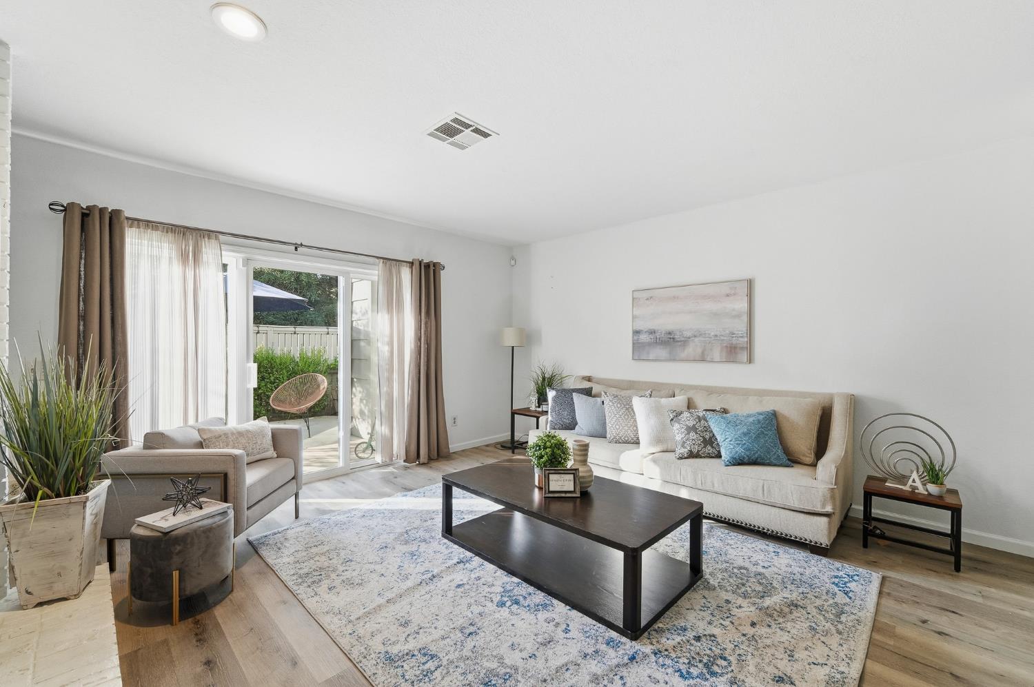 230 West Rumble Road, Unit C Modesto, CA 95350 - Photo 25 of 54 a living room with furniture and a window